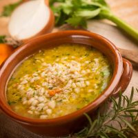 barley soup with vegetables, selective focus